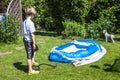 Little boy blowing up inflatable swimming pool Royalty Free Stock Photo