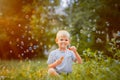 A little boy blows soap bubbles Royalty Free Stock Photo
