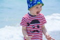 Little boy with blue eyes screaming with happiness on the beach, hamming, Royalty Free Stock Photo