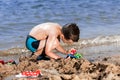 Little boy in blue sea Royalty Free Stock Photo