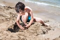 Little boy in blue sea Royalty Free Stock Photo