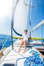 Little boy on board of sailing yacht on summer cruise. Travel adventure, yachting with child on family vacation. Royalty Free Stock Photo