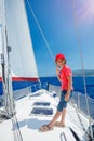 Little boy on board of sailing yacht on summer cruise. Travel adventure, yachting with child on family vacation. Royalty Free Stock Photo