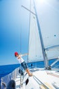 Little boy on board of sailing yacht on summer cruise. Travel adventure, yachting with child on family vacation. Royalty Free Stock Photo
