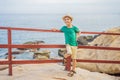 Little boy on boardwalk with stairs to the beach, vacation concept Royalty Free Stock Photo