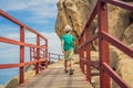 Little boy on boardwalk with stairs to the beach, vacation concept Royalty Free Stock Photo