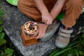 a little boy borrowed a manual coffee grinder and grinded biscuits.