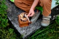 a little boy borrowed a manual coffee grinder and grinded biscuits.