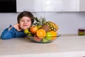 Little boy with a bowl of fresh fruits Royalty Free Stock Photo