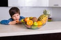 Little boy with a bowl of fresh fruits Royalty Free Stock Photo