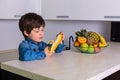 Little boy with a bowl of fresh fruits Royalty Free Stock Photo