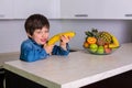 Little boy with a bowl of fresh fruits Royalty Free Stock Photo