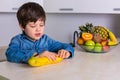 Little boy with a bowl of fresh fruits Royalty Free Stock Photo