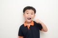 Little boy brushing his teeth on white background Royalty Free Stock Photo