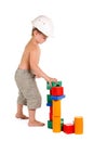 Little boy builds a house of toys Royalty Free Stock Photo