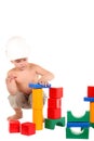 Little boy builds a house of toys Royalty Free Stock Photo