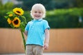 Little boy with bunch of sunflowers outdoors Royalty Free Stock Photo