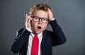 little boy in business suit with cell phone. child boss. fashionable kid in suit and tie and glasses. Back to business Royalty Free Stock Photo