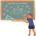 Boy came to school for first time stands near blackboard with inscription welcome to our family