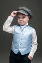 Little boy in cap and blue vest Royalty Free Stock Photo