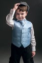 Little boy in cap and blue vest Royalty Free Stock Photo