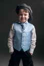 Little boy in cap and blue vest Royalty Free Stock Photo