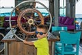Little boy captain with steering wheel on ship Royalty Free Stock Photo