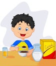 Little boy cartoon having breakfast cereals with milk