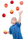Little boy caughts flying apple Royalty Free Stock Photo