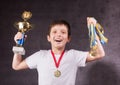 Little boy celebrates his golden trophy Royalty Free Stock Photo