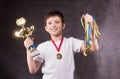 Little boy celebrates his golden trophy Royalty Free Stock Photo