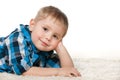 Little boy in a checked shirt on the carpet Royalty Free Stock Photo
