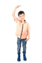 Little boy checking his height isolate on white background