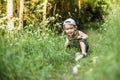 Little boy child caucasian white skin in forest smiling