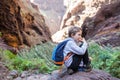 Little boy child eating sandwich while resting on mountain trail. Royalty Free Stock Photo