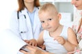 Little boy child with his mother after health exam at doctor`s office