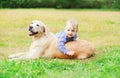 Little boy child playing with Golden Retriever dog Royalty Free Stock Photo