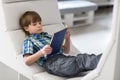 Little boy child reading a book in the library Royalty Free Stock Photo