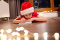 Little boy child in Santa Claus cap writing a letter to Santa. Royalty Free Stock Photo