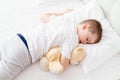 Little boy child sleeping in bed on his stomach Royalty Free Stock Photo