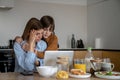 Little boy child supporting upset tired unemployed mother at home Royalty Free Stock Photo