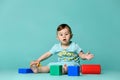 Little boy child toddler playing with block toys