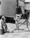 Little boy with chimpanzee taking pictures