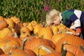 Little Boy choosing a Pumpkin