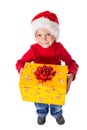 Little boy in christmas hat with gift box Royalty Free Stock Photo