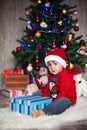 Little boy on christmas, opening presents Royalty Free Stock Photo