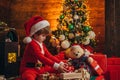 Little boy with Christmas presents. Holidays and winter childhood concept. Gifts service. Gifts for winter holidays at Royalty Free Stock Photo