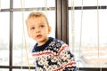 Little boy in christmas sweater look up Royalty Free Stock Photo