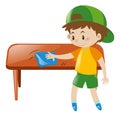 Little boy cleaning table with cloth