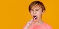 Little boy cleaning teeth with kids toothbrush. Dental hygiene. Little man brushing teeth. Happy child kid boy with Royalty Free Stock Photo